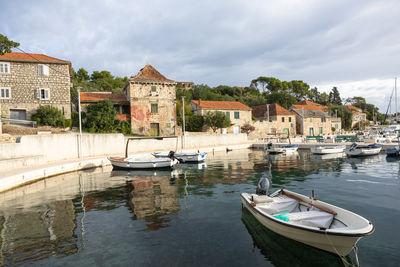 Boats moored at harbor