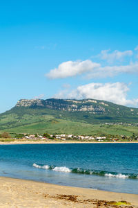 Scenic view of sea against blue sky