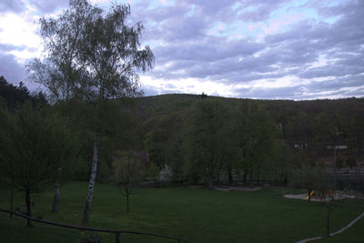 Scenic view of landscape against cloudy sky