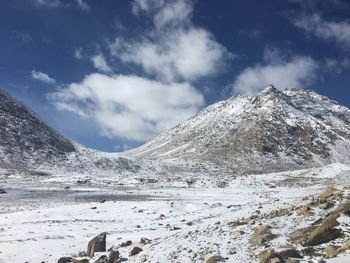 Scenic view of snowcapped mountains against sky