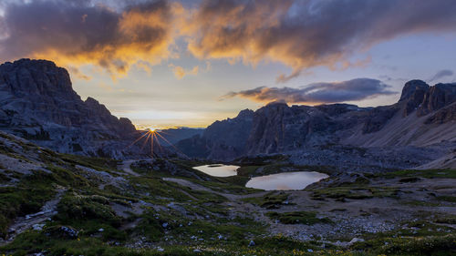 Scenic view of snowcapped mountains against sky during sunset