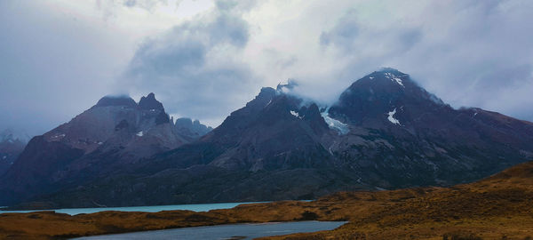 Scenic view of snowcapped mountains against sky