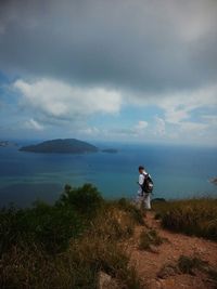 Scenic view of sea against cloudy sky
