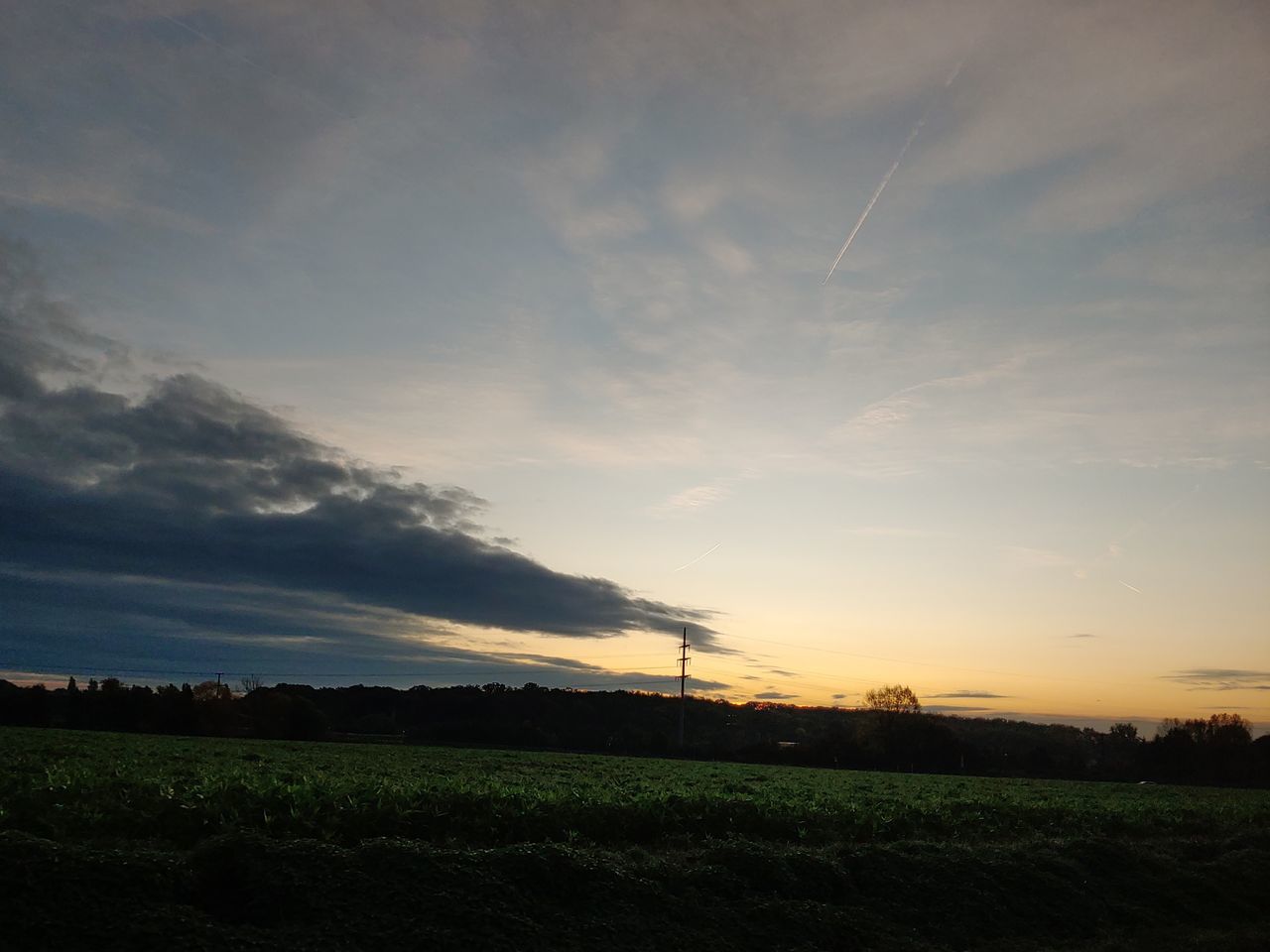 sky, cloud - sky, landscape, environment, sunset, tranquil scene, scenics - nature, beauty in nature, tranquility, field, land, nature, no people, rural scene, idyllic, non-urban scene, agriculture, outdoors, plant, orange color, electricity, vapor trail, power supply