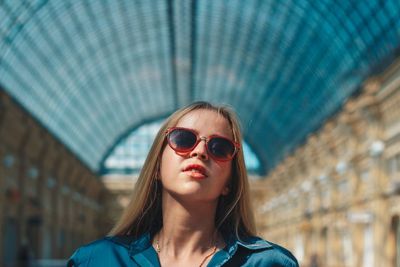 Portrait of a young woman wearing sunglasses