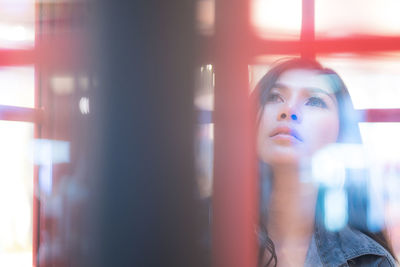 Portrait of a young woman looking away