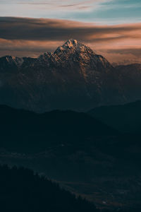 Scenic view of mountains against sky during sunset