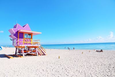 Lifeguard hut on beach against blue sky miami beach 