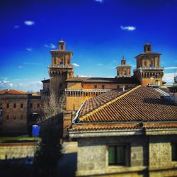 Low angle view of built structure against blue sky