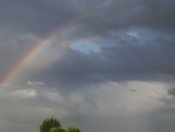 Low angle view of rainbow against sky