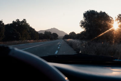 Road seen through car windshield