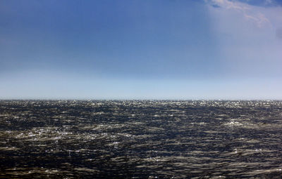 Aerial view of city and sea against clear sky