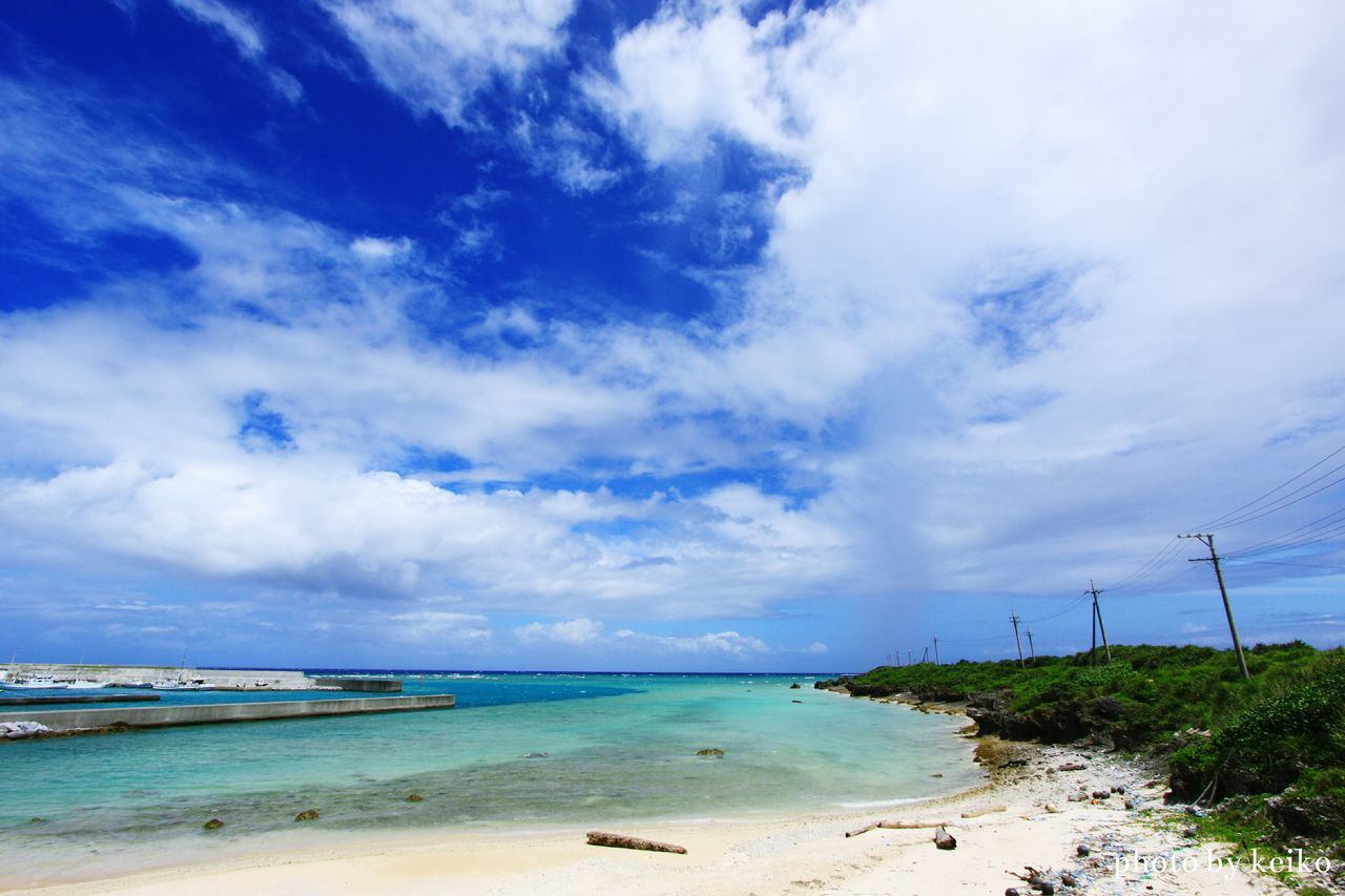 sea, water, sky, horizon over water, tranquil scene, tranquility, scenics, shore, beauty in nature, blue, nature, cloud - sky, cloud, idyllic, coastline, day, calm, non-urban scene, outdoors, cloudy, grass, remote, no people, non urban scene, ocean, growth