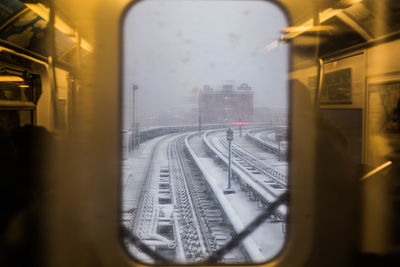 Railroad tracks seen through train window