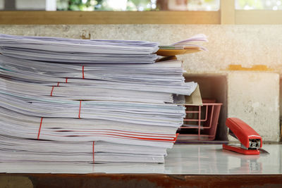 Stack of papers on table at home