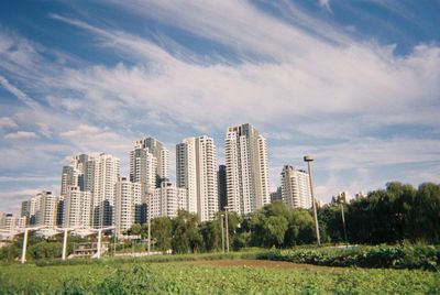 Low angle view of buildings in city against sky