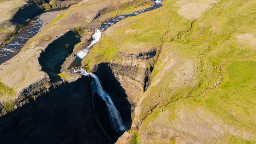 High angle view of rocks by river