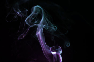 Close-up of smoke against black background