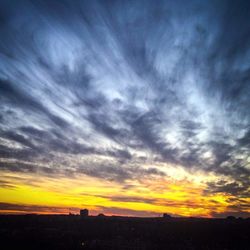 Scenic view of dramatic sky at sunset