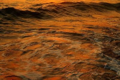 Full frame shot of dramatic orange sea