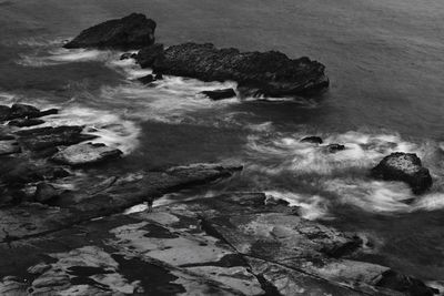 High angle view of rocks in sea