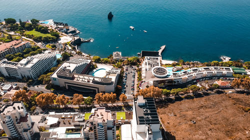 High angle view of townscape by sea
