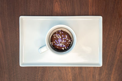 High angle view of coffee cup on table