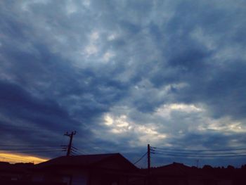 Low angle view of silhouette building against sky during sunset