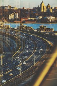 High angle view of highway by buildings in city