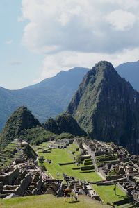 High angle view of mountain range against cloudy sky