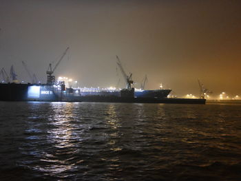 Scenic view of sea against sky at night