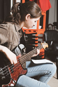 Woman playing guitar