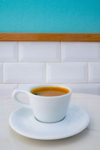 Close-up of coffee cup on table