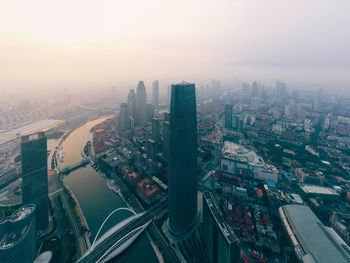 High angle view of modern city buildings against sky