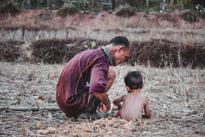 Father and son on land