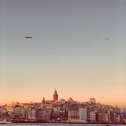View of city against sky during sunset