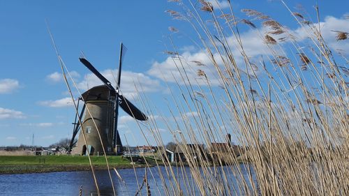 Traditional windmill against sky