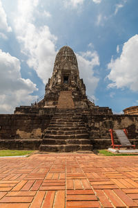 View of temple building against cloudy sky