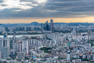 Aerial view of cityscape against sky during sunset