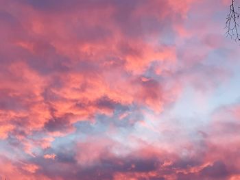 Low angle view of dramatic sky during sunset