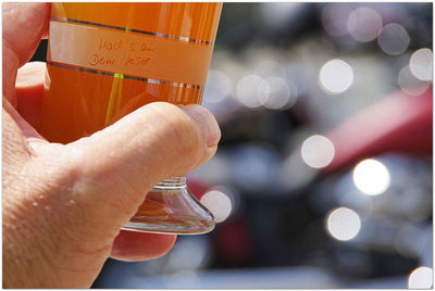 Close-up of hand holding drink