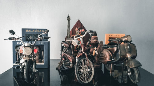 Bicycles parked against wall