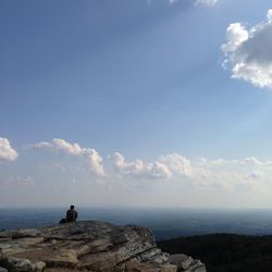 Scenic view of landscape against cloudy sky