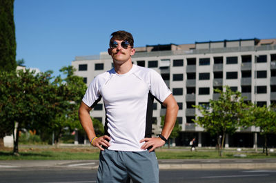 Young happy handsome bearded man, tourist relaxing in city koper. summer vacation. sunglasses.