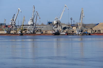 View of a large river and river port with special equipment and water transport. high quality photo