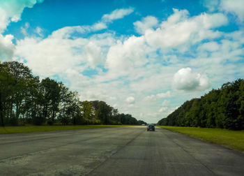 View of road against cloudy sky