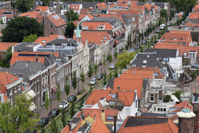 High angle view of street amidst buildings in town