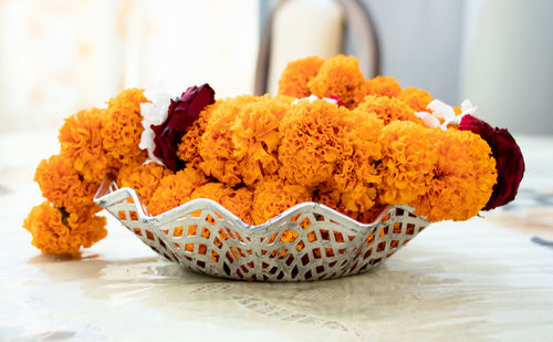 Close-up of marigold served on table