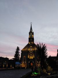 View of illuminated building at dusk