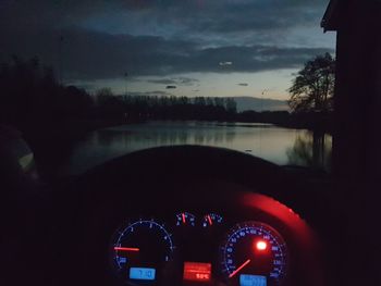 View of illuminated car at sunset